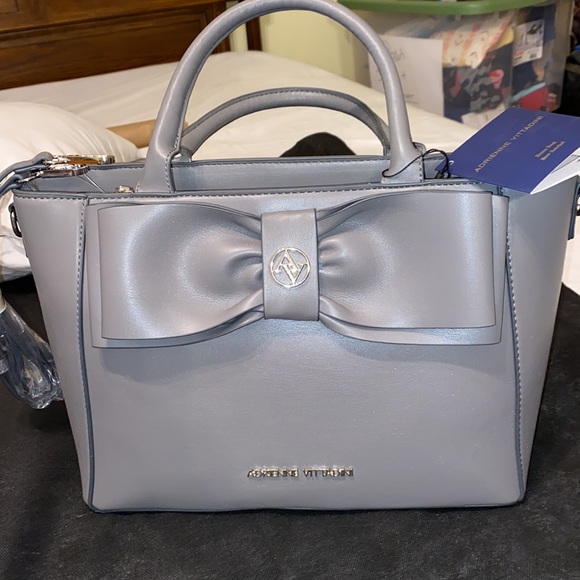 Purse with bow design on front. Brand new with tag. Gray purse. - Picture 2 of 16